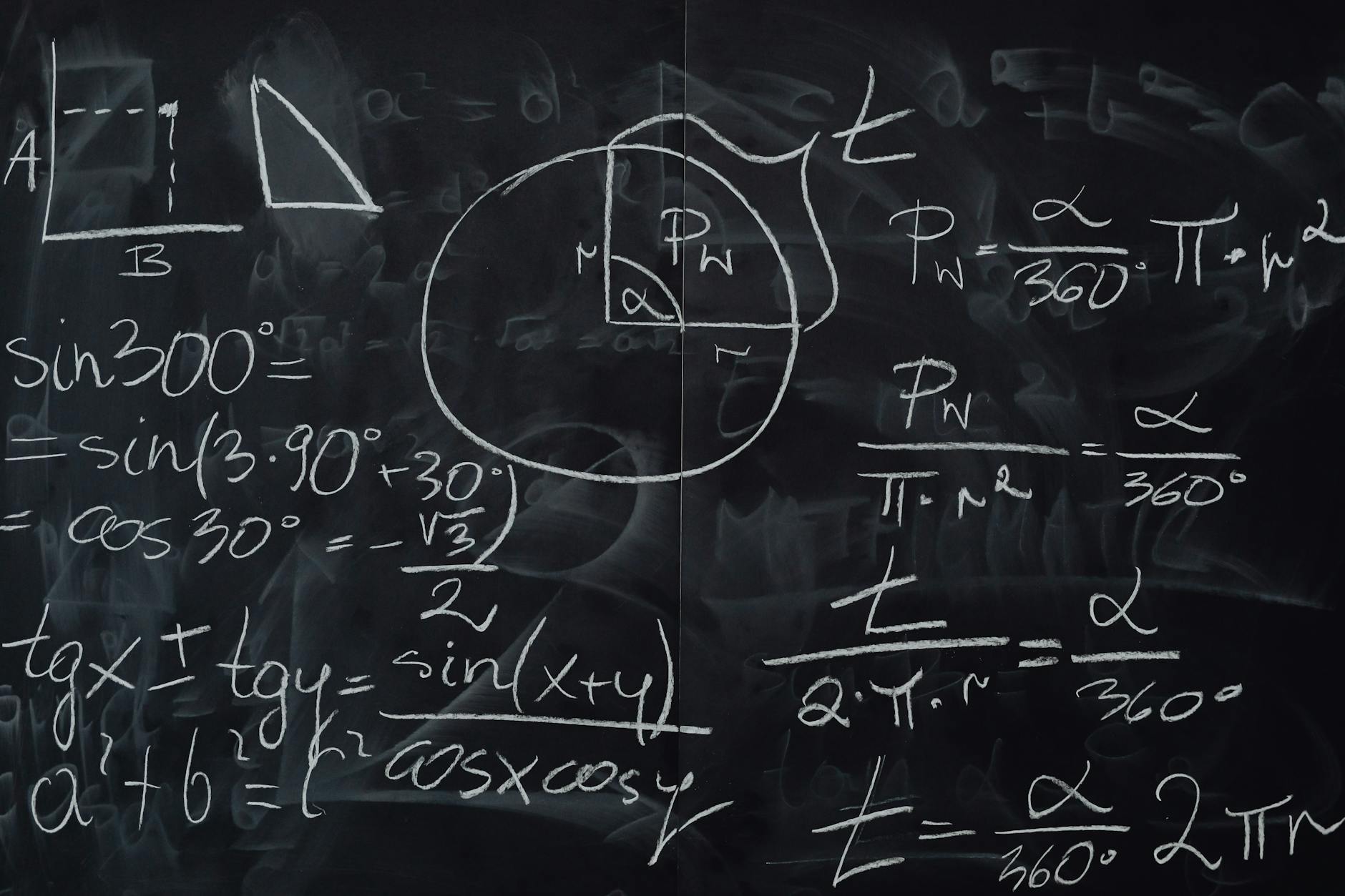 Blackboard with handwritten calculations